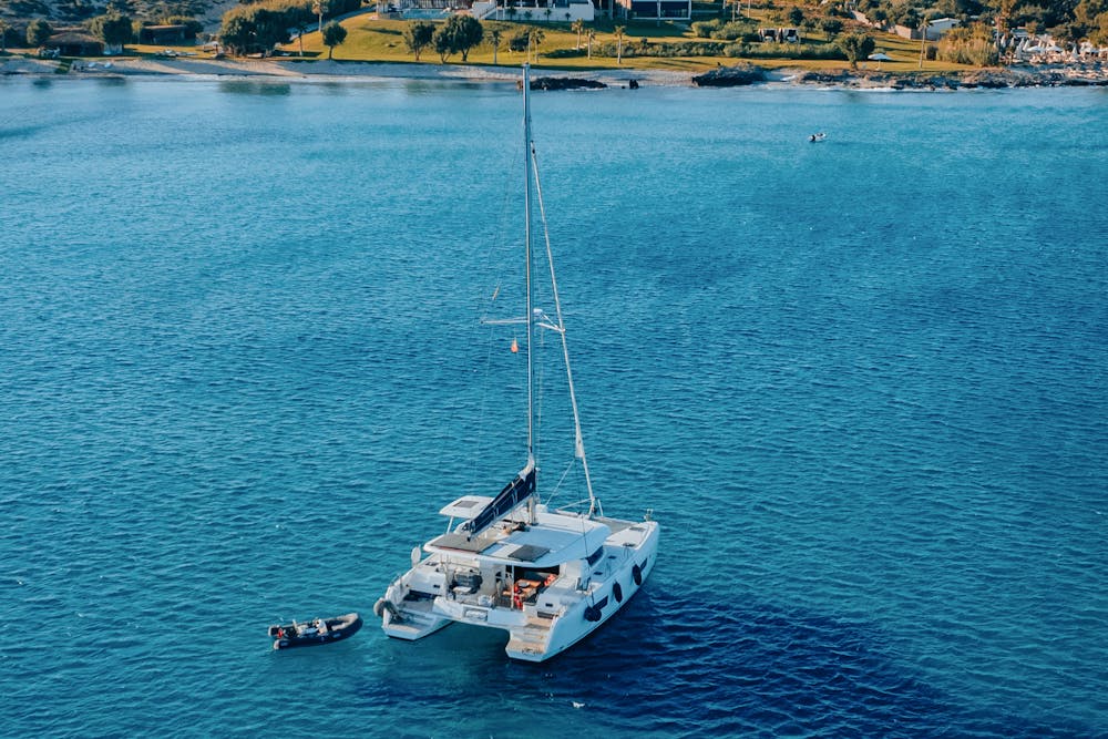 A catamaran on bright blue water off Cozumel